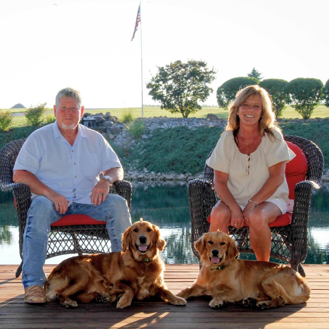 David and Judy Ziegler with their dogs on the porch at Eden Acres View Farm