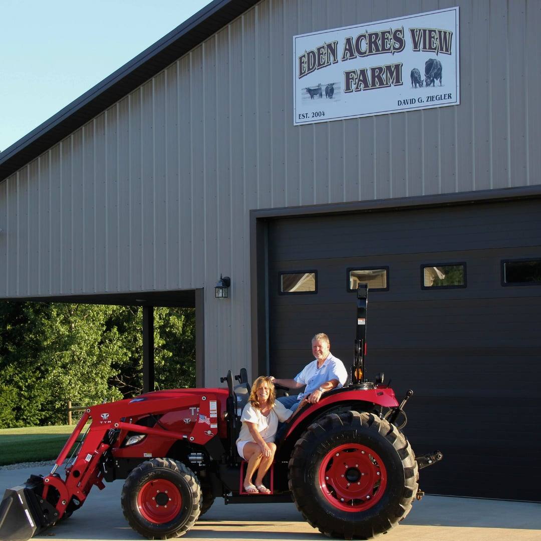 David and Judy Ziegler on their tractor at Eden Acres View Farm